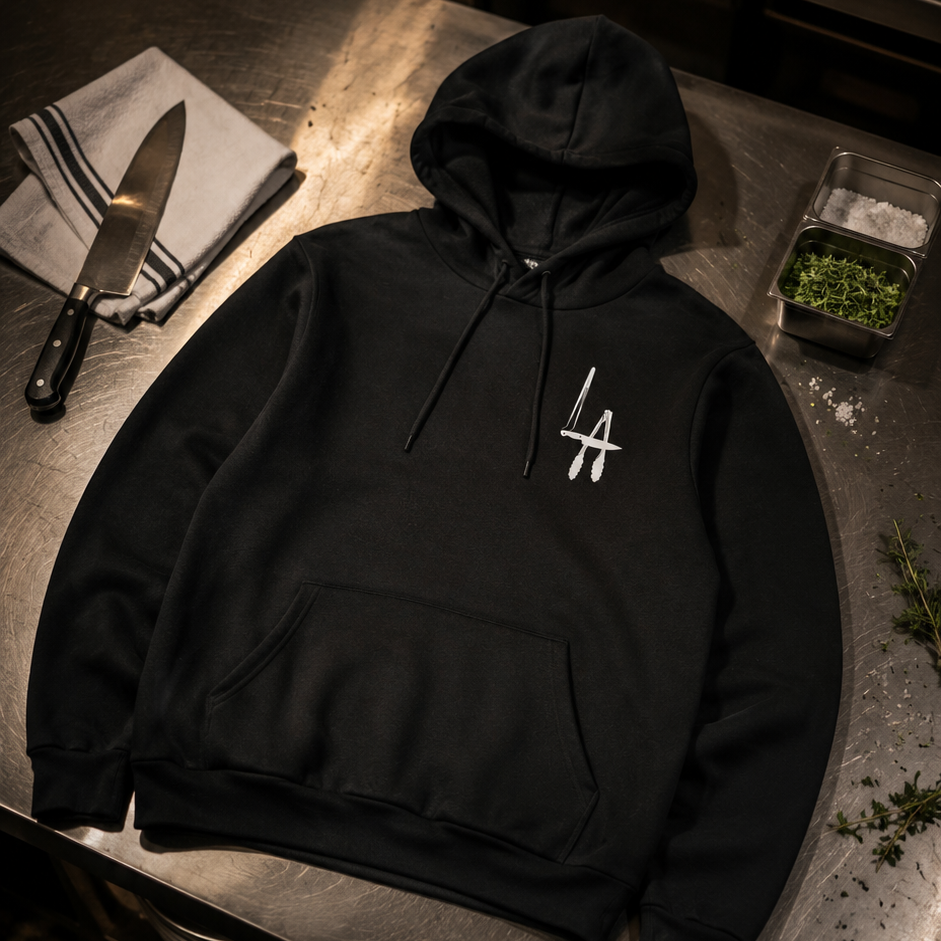 Black hoodie with a logo on a metal surface
